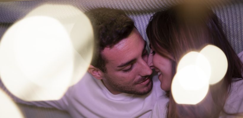 romantic-couple-kissing-blanket