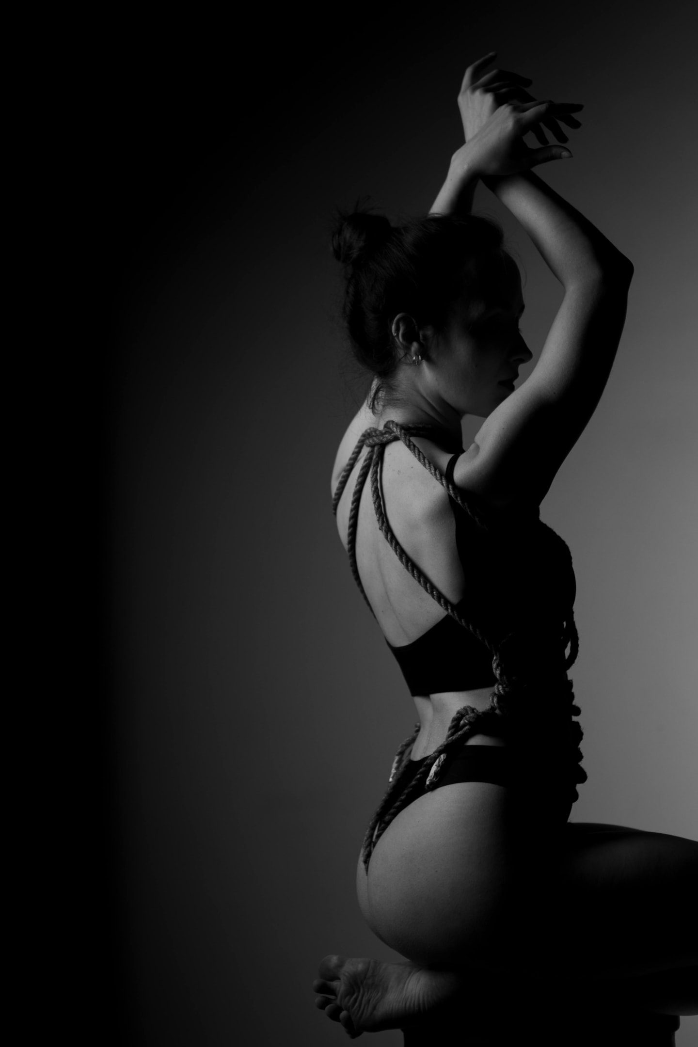 In this image, a couple engages in a passionate and intimate scene that explores themes of sexual sadism and masochism, showcasing their consensual power exchange and the emotional excitement derived from their unique sexual interests. The atmosphere is charged with sexual arousal as they embrace the pleasure found in both inflicting and receiving pain, highlighting their shared fantasies and deep connection.